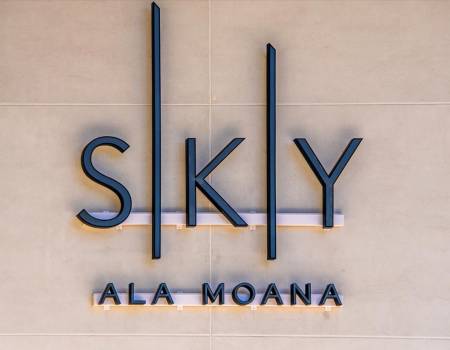 A sign inside Sky Ala Moana, a skyscraper with incredible Honolulu vacation rentals.