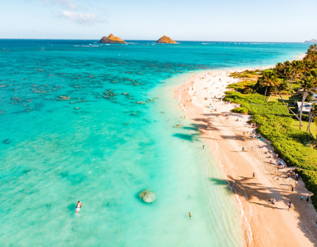 People at the beach, one of the best things to do on Oahu.