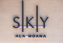 A sign inside Sky Ala Moana, a skyscraper with incredible Honolulu vacation rentals.