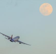 Airplane flying into moon