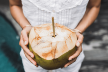 holding green coconut