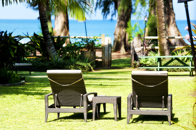 Two chaise lounges in yard looking towards Hanalei Bay