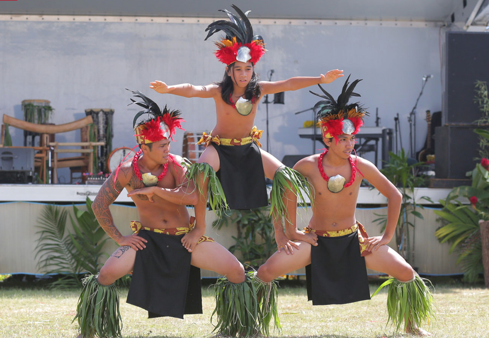 Three male performers in pyramid