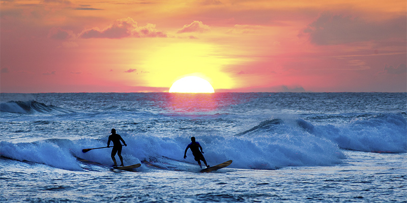sunset surfing