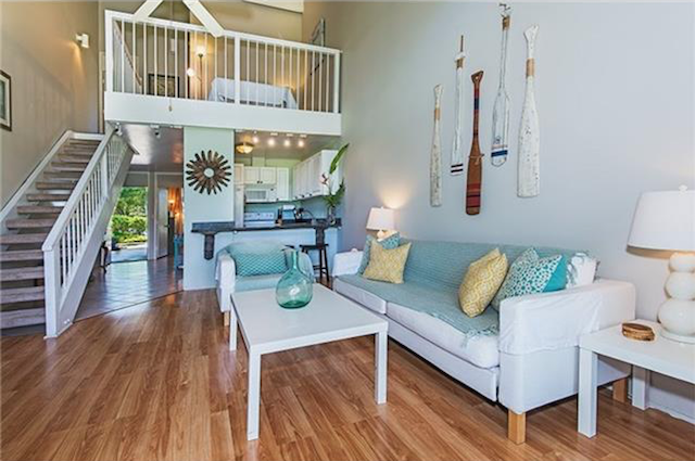 Living room with loft above