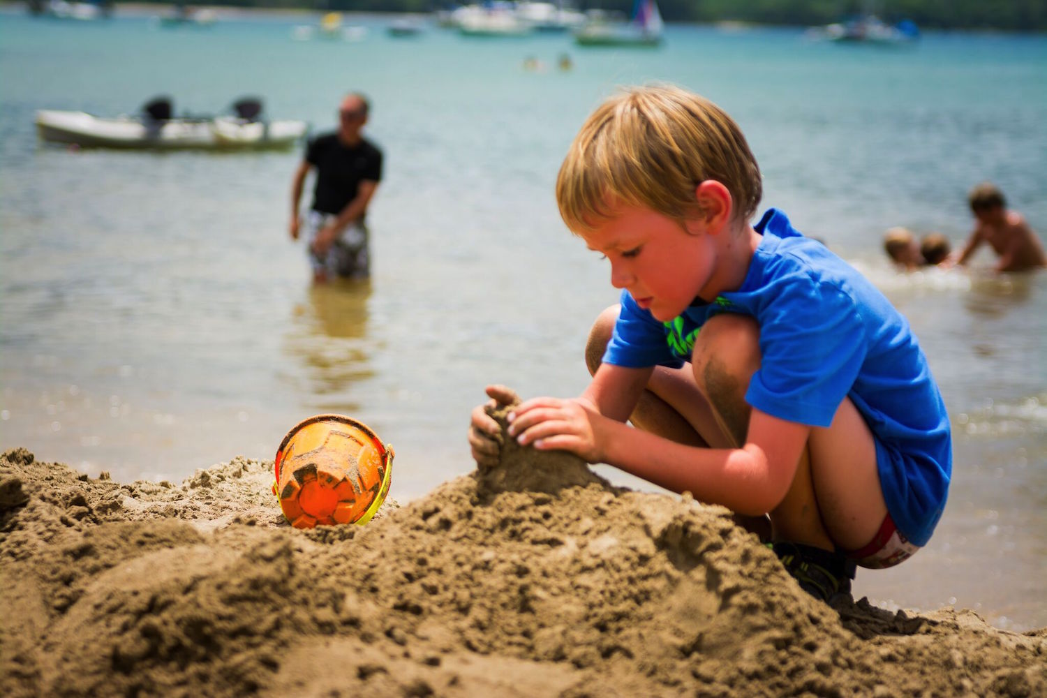 Little boy building castle